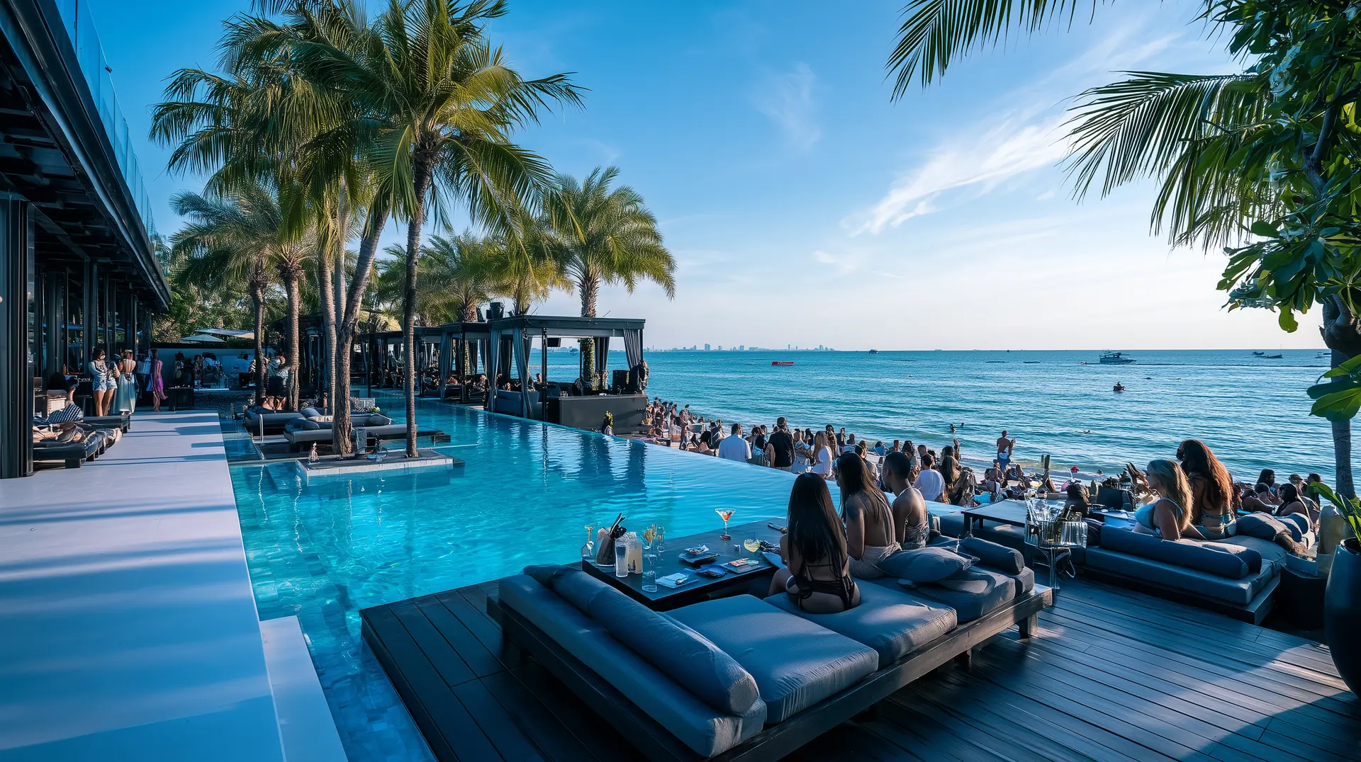 Premium beachfront beach club Pattaya Thailand infinity pool daybeds sea view