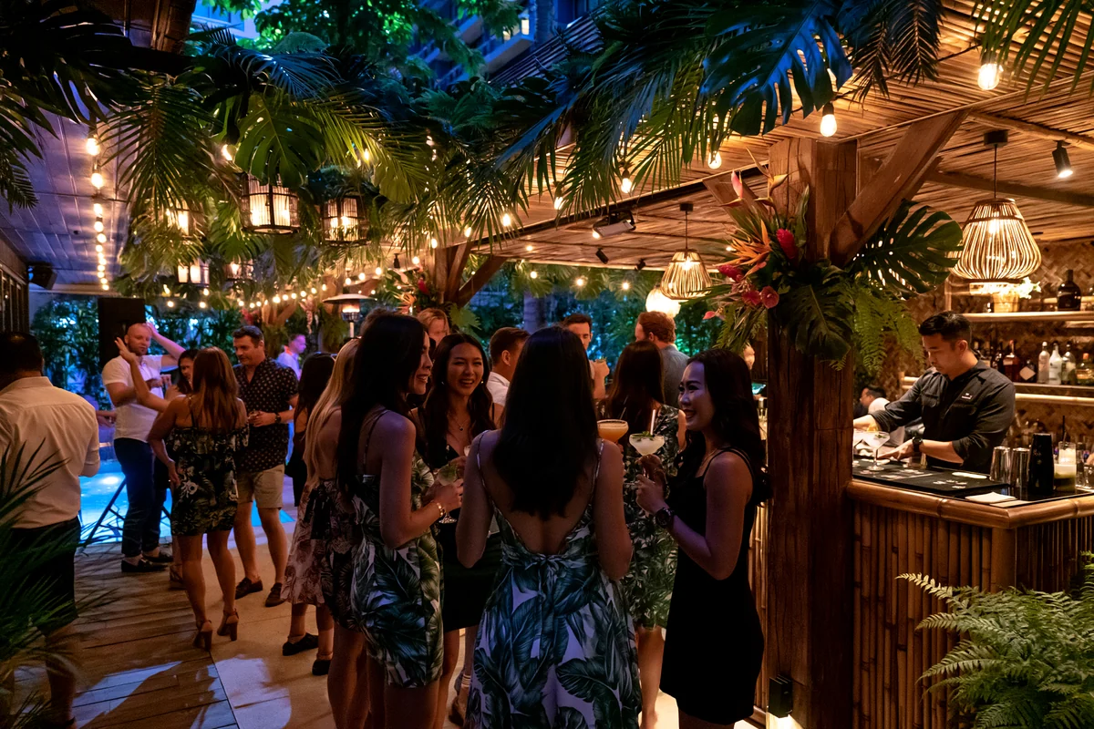 Tropical jungle themed party on a Pattaya villa terrace with bamboo bar, lush foliage and lanterns